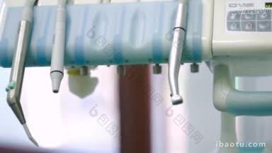 牙科诊所的<strong>医疗</strong>设备和牙医把工具放在它的地方的多莉特写镜头